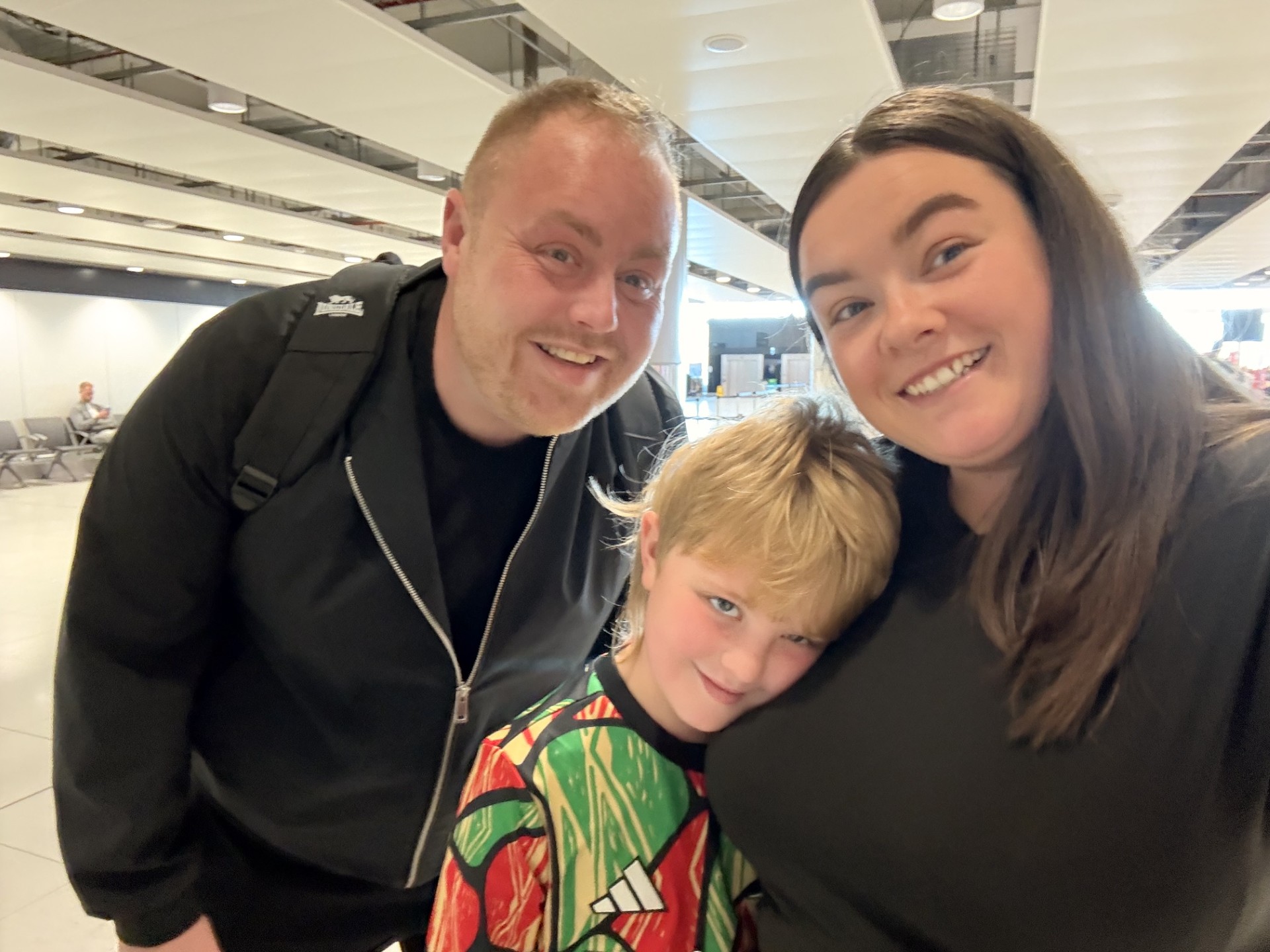 Alisha, James and Henry at the airport ready for a family trip