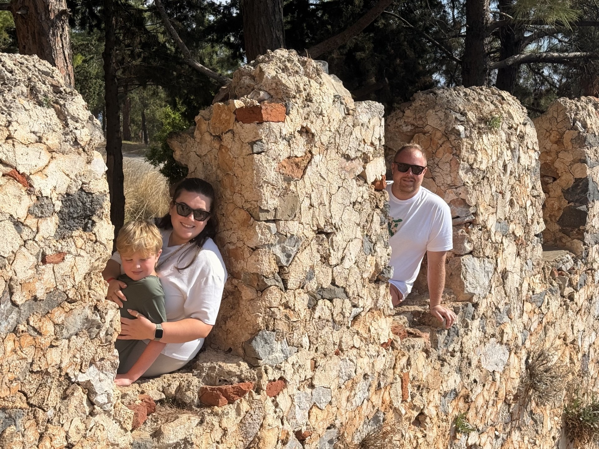 Alisha, James and Henry together among old stone ruins